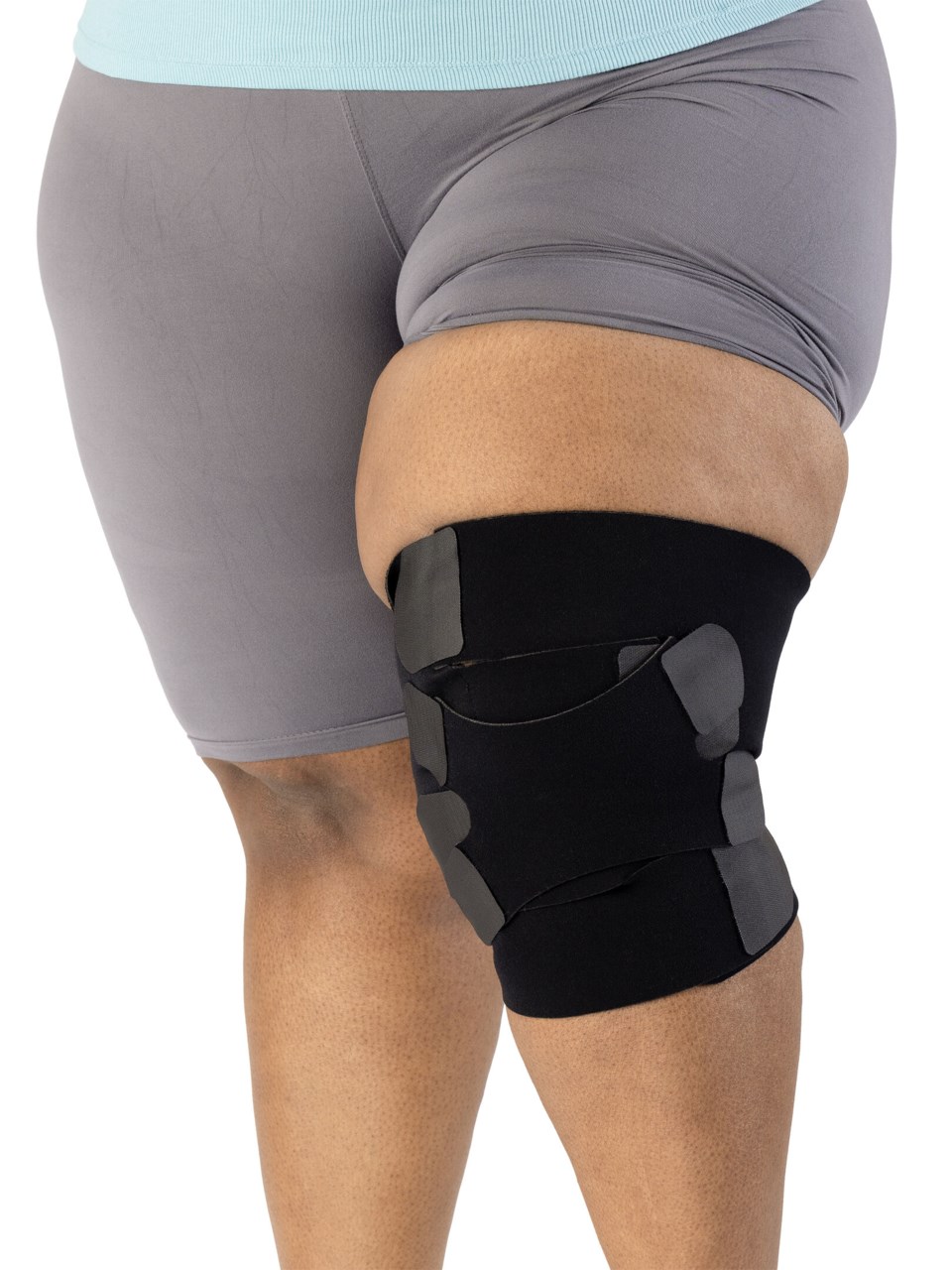 Woman wearing Sigvaris Compreflex Contain Knee adjustable inelastic compression garment in the color Black