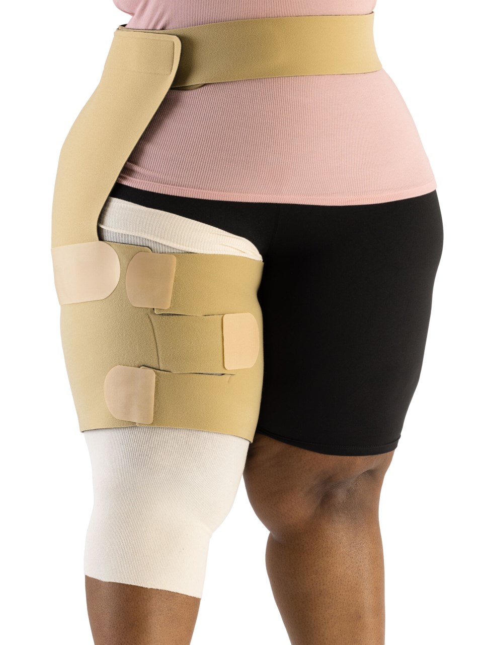 Woman wearing Sigvaris Compreflex Contain Thigh inelastic wrap on right thigh in the color Beige