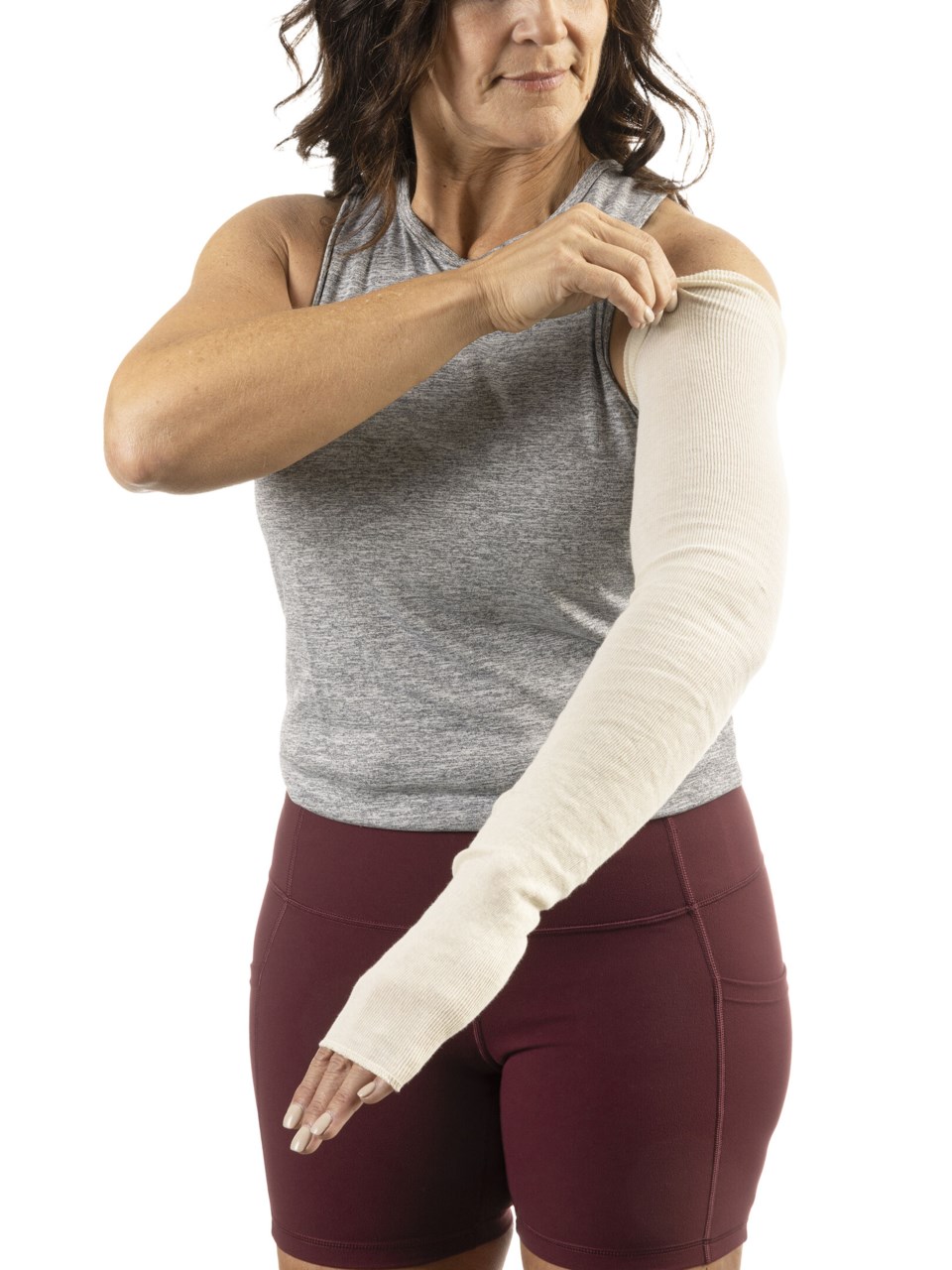 Female wearing a white non-compressive cotton arm liner