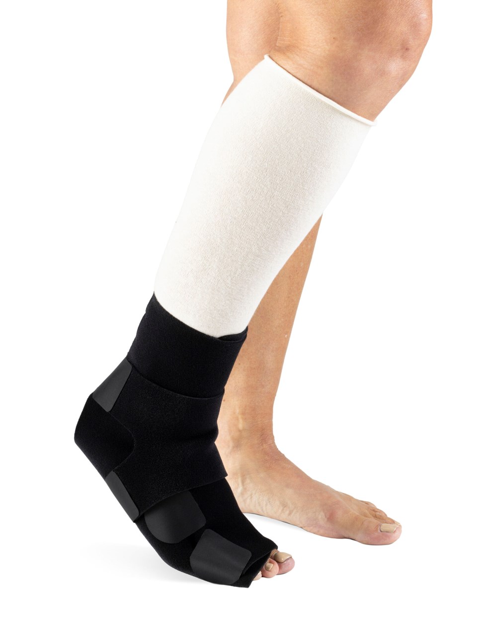Woman wearing Sigvaris MCE Compreflex Reduce Foot compression garment in black