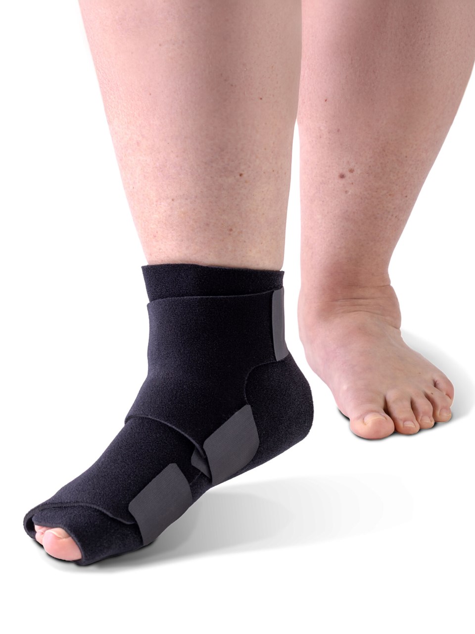 Woman wearing Sigvaris MCE Compreflex Reduce Foot compression garment in black