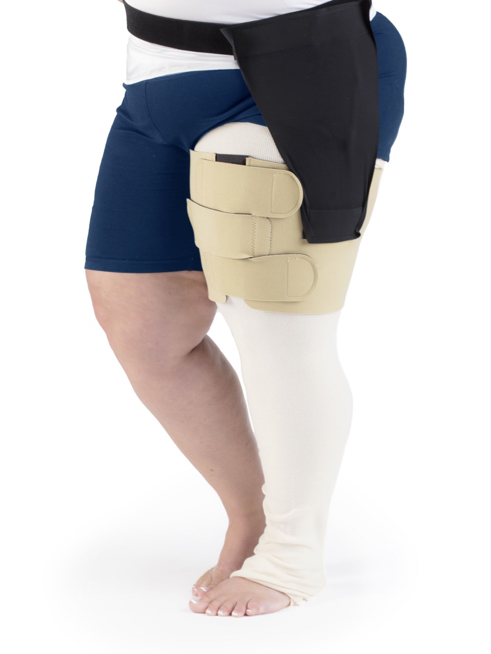 Female wearing COMPREFLEX REDUCE THIGH in BEIGE with belt and hip attachment in BLACK