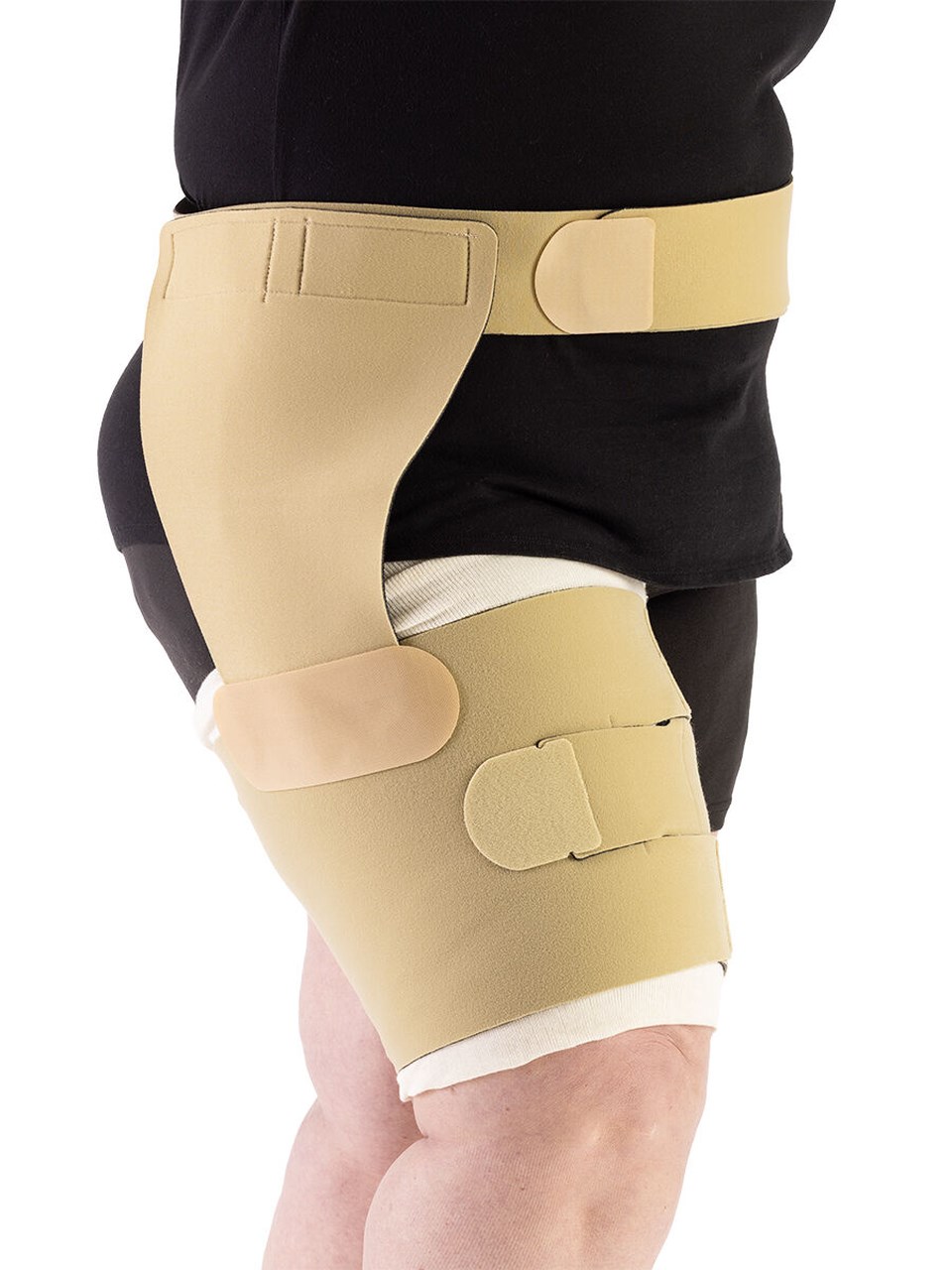 Female wearing COMPREFLEX REDUCE THIGH in BEIGE with belt and hip attachment in BLACK