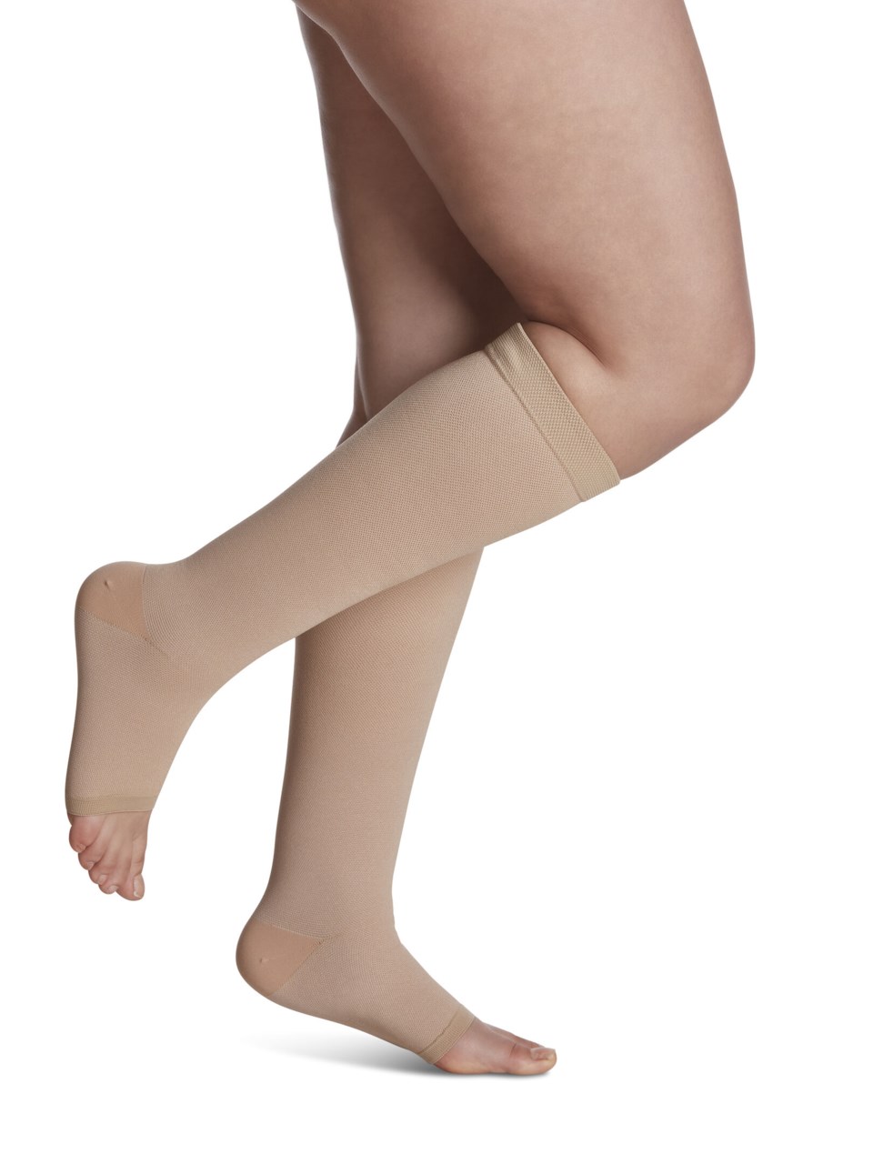 Female wearing SPECIALTY NATURAL RUBBER open toe compression calf stockings in BEIGE