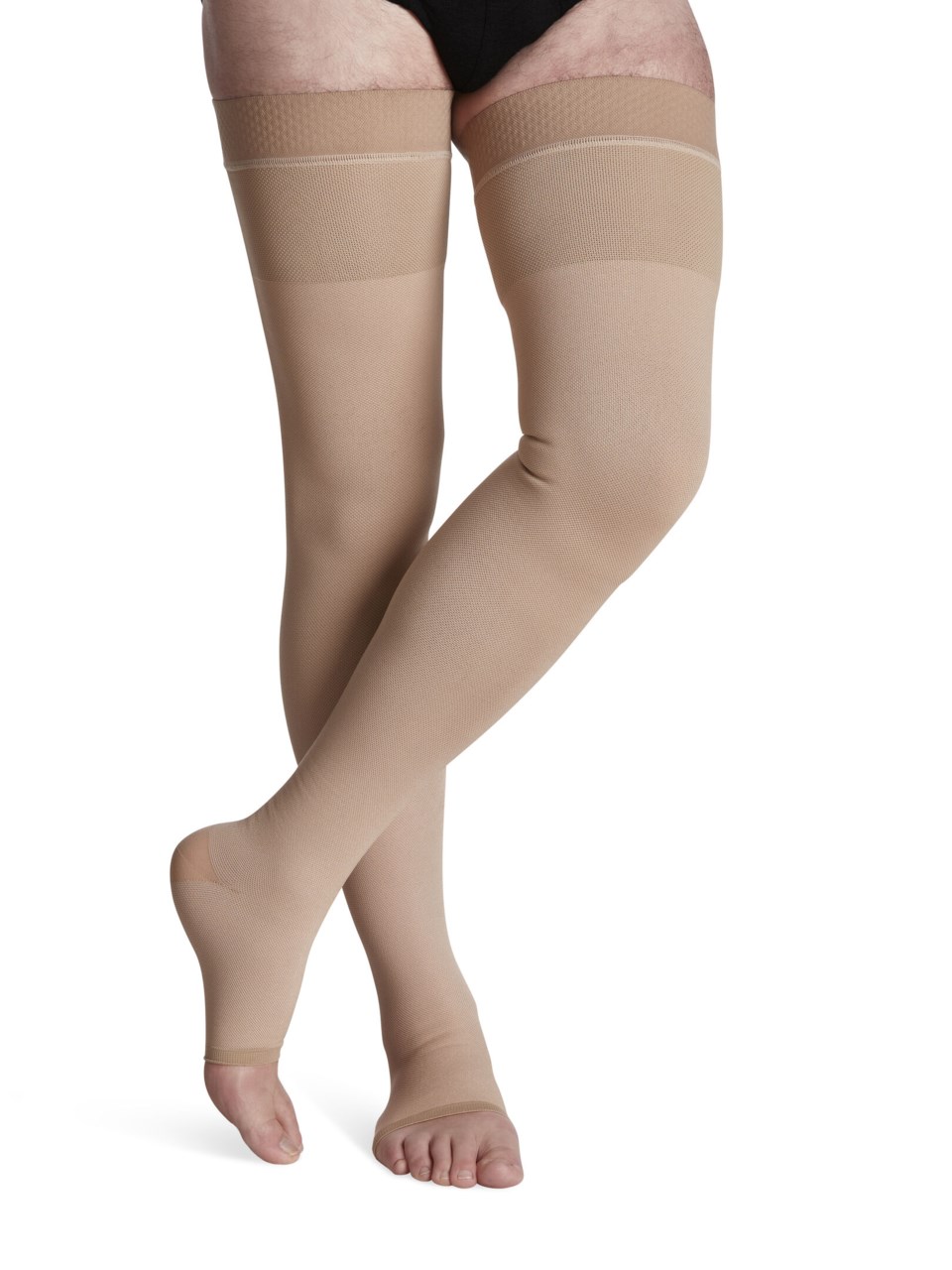 Male wearing SPECIALTY NATURAL RUBBER open toe compression thigh highs in BEIGE