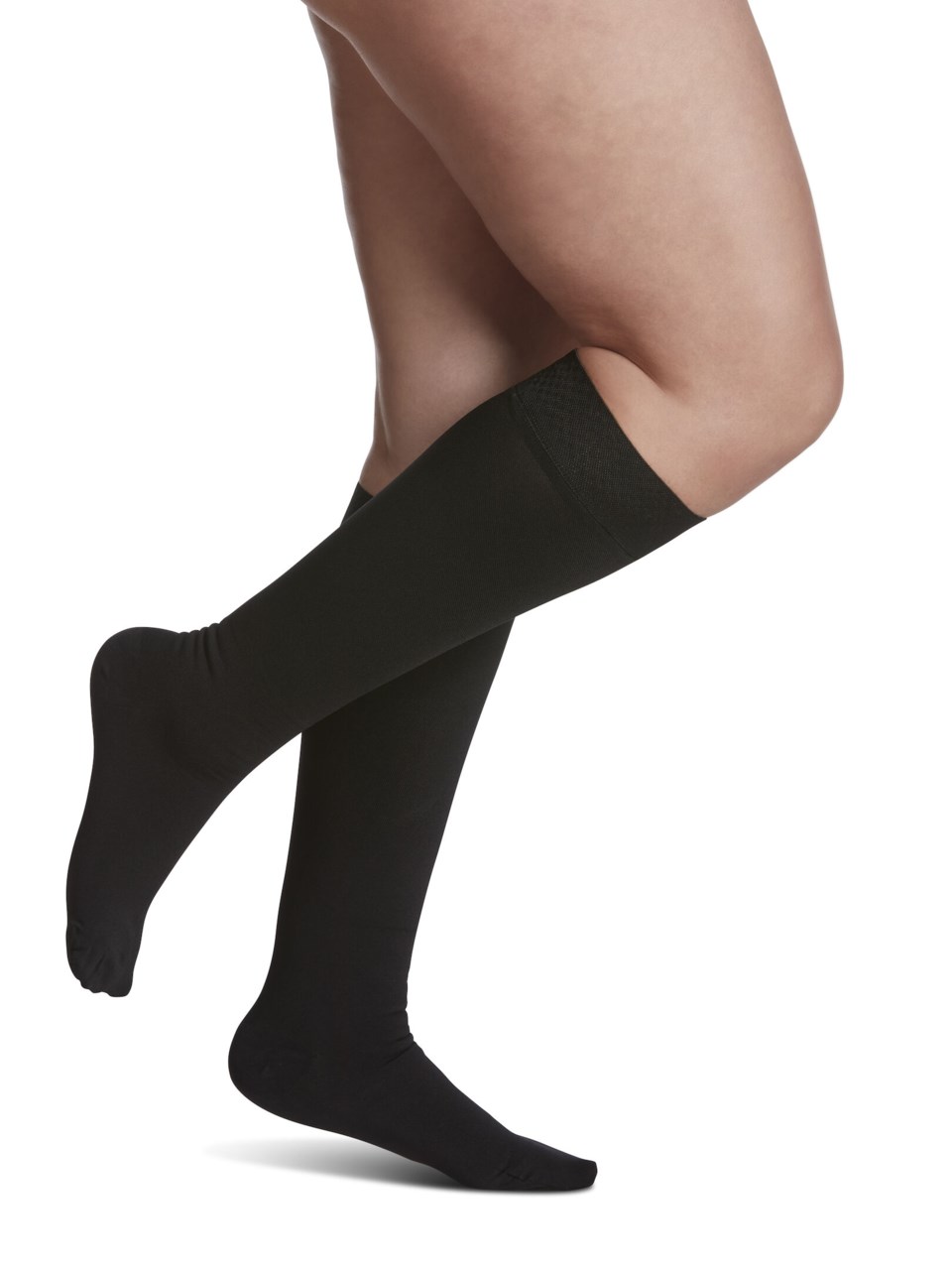 Female wearing SPECIALTY SECURE grip top compression calf stockings in BLACK