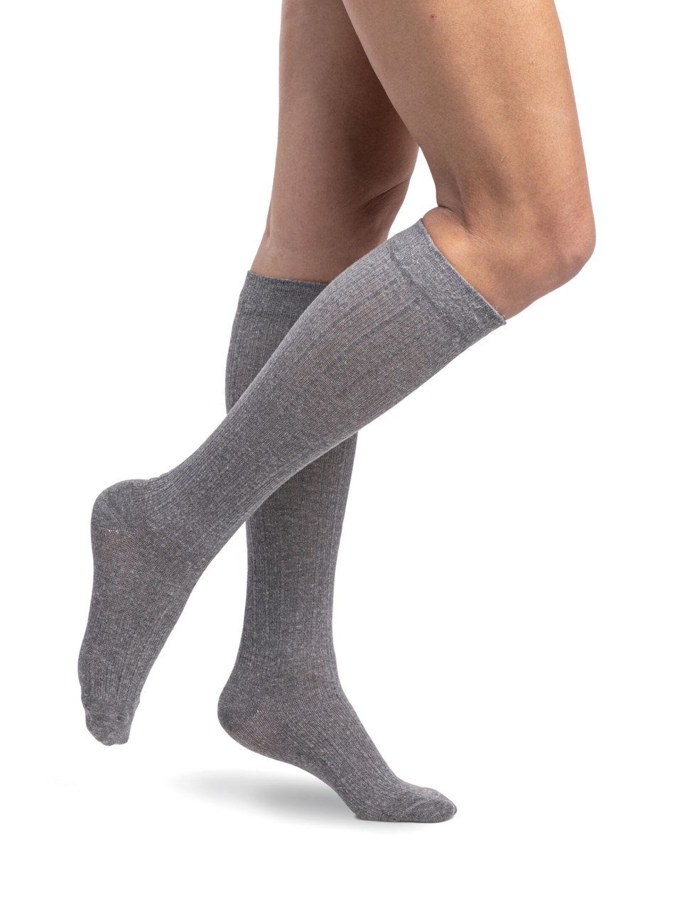 Female wearing WELLBEING LINEN compression socks in LIGHT GREY