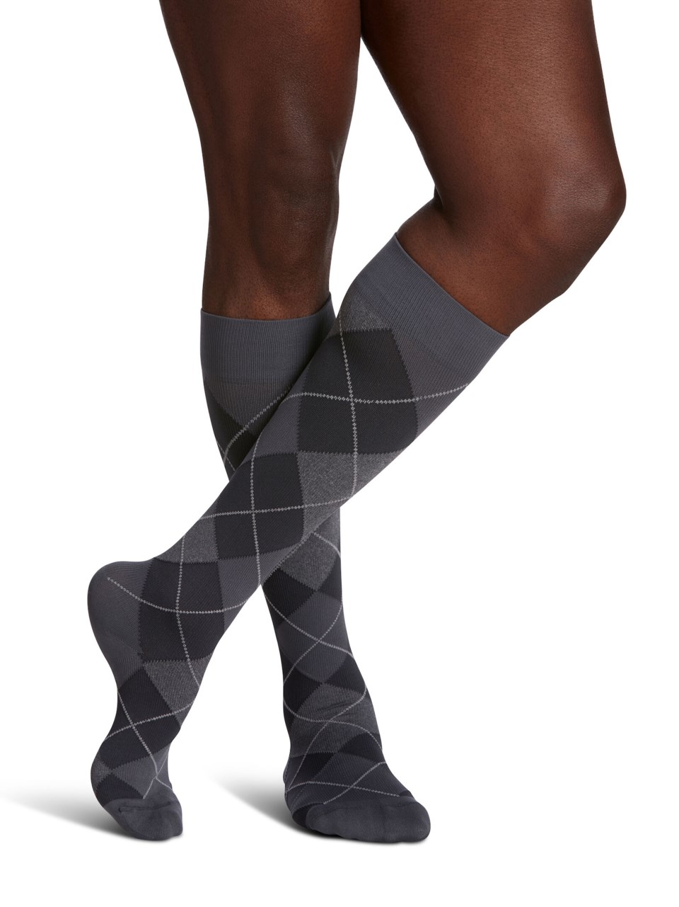Man wearing STYLE: MICROFIBER PATTERNS (AKA WELLBEING: MICROFIBER SHADES) compression socks in GRAPHITE ARGYLE